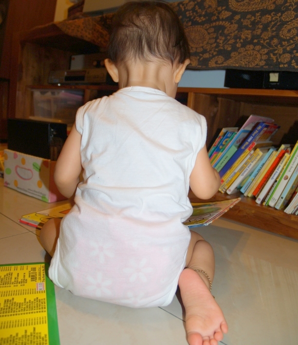 Zaria reading in the living room