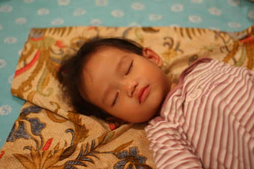 Zaria sleeping on her sarong