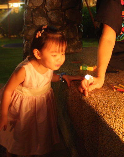 Tasha blowing off the candle