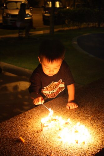 Wei Hao lighting a candle