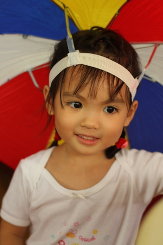 Tasha in an umbrella hat - Pulau Ketam