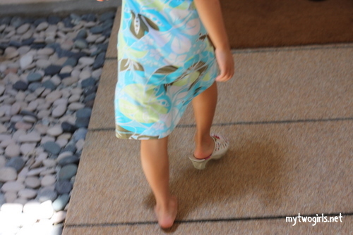 Zara wearing the right side of the Click Clock Shoes