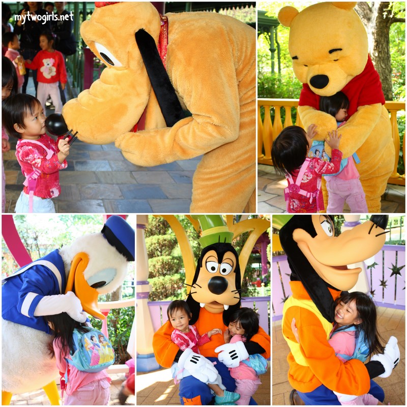 Girls with Goofy, Donald Duck, Pluto and Winnie the Poo