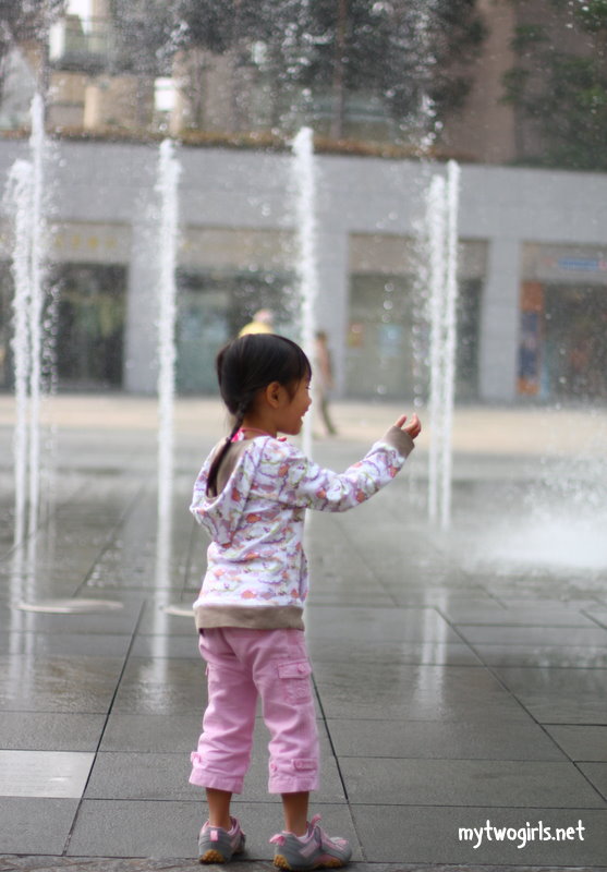 Zara watching the fountain outside Citygate Outlet Mall