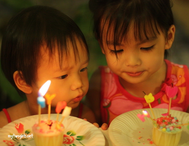 Tasha & Zaria blowing candles