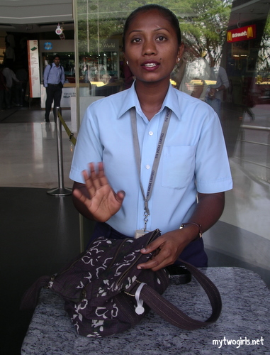 Security guard going through my bag in a mall