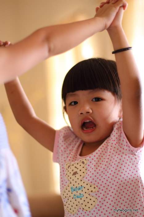 Krystal playing London Bridge with the girls