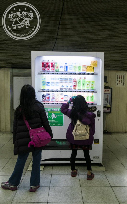 choosing a drink at the vending machine